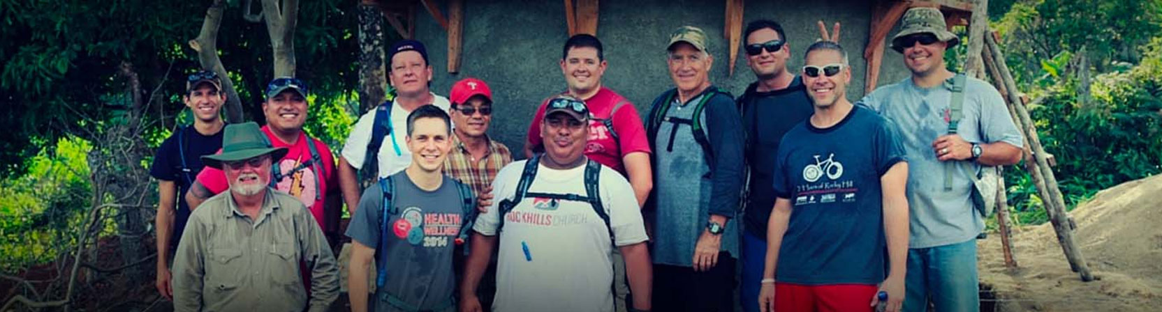 A volunteer works alongside Honduran compañeros