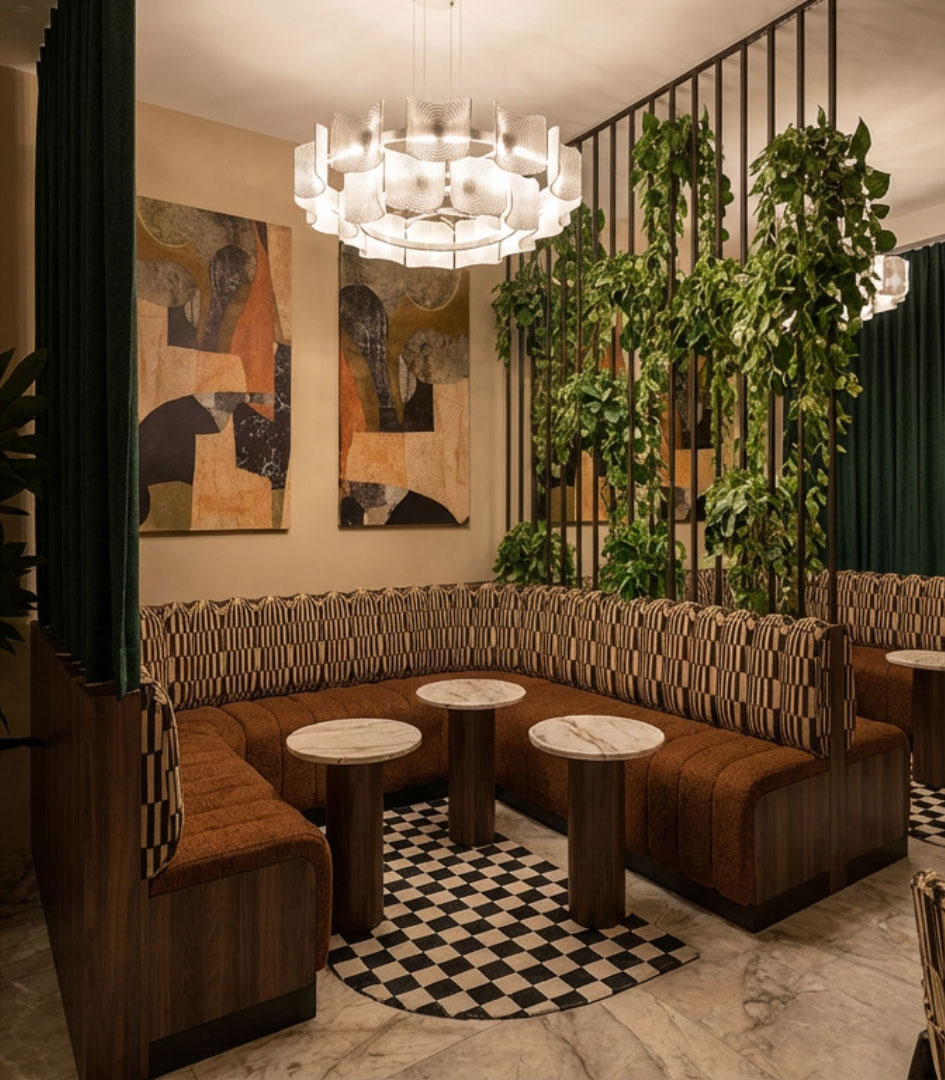 Diverse group of stylish professionals socializing at Sanctuary